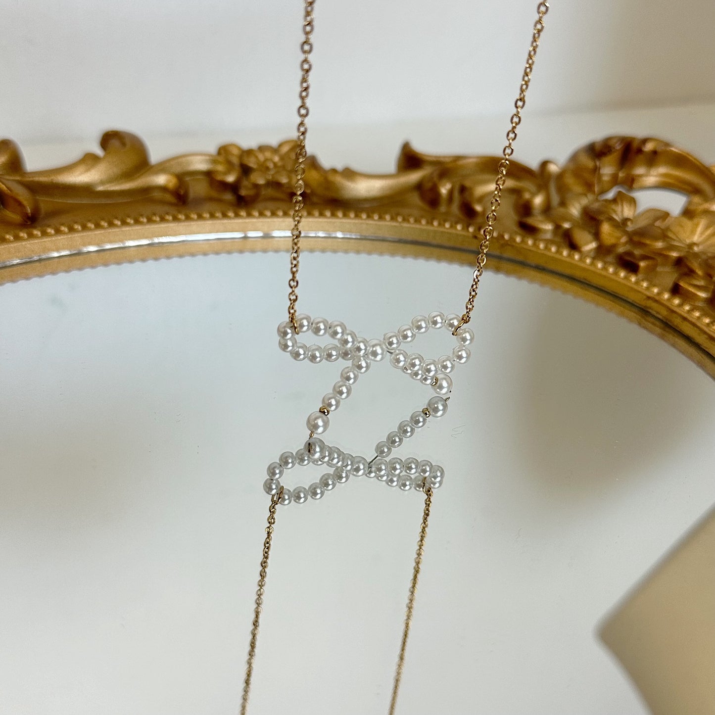 Bow pearl necklace